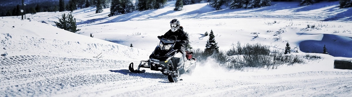 2014 Ski Doo snowmobile skiing through snow